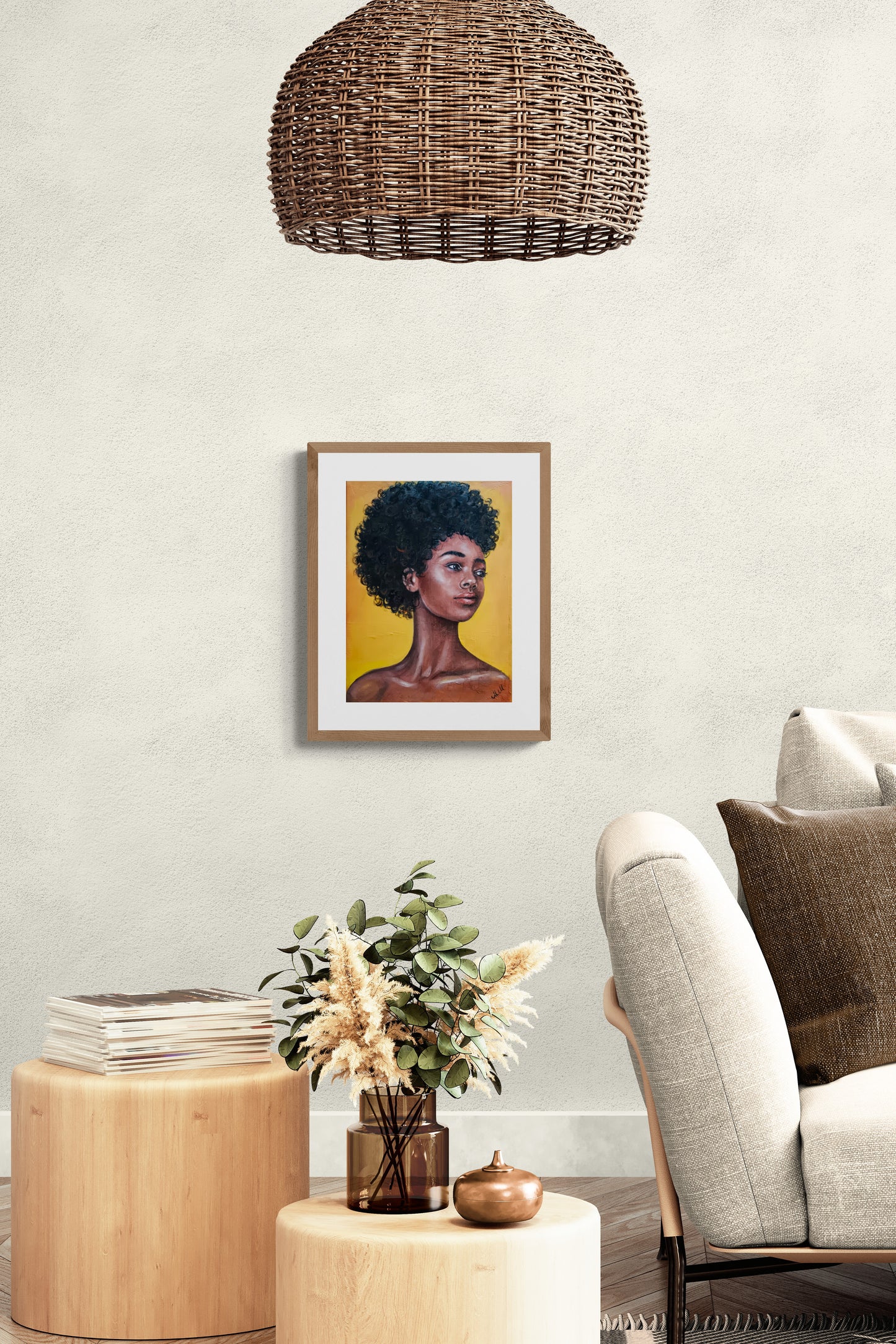 Living room with a framed artwork of a person with braided hair, a beige armchair, and a wooden side table.