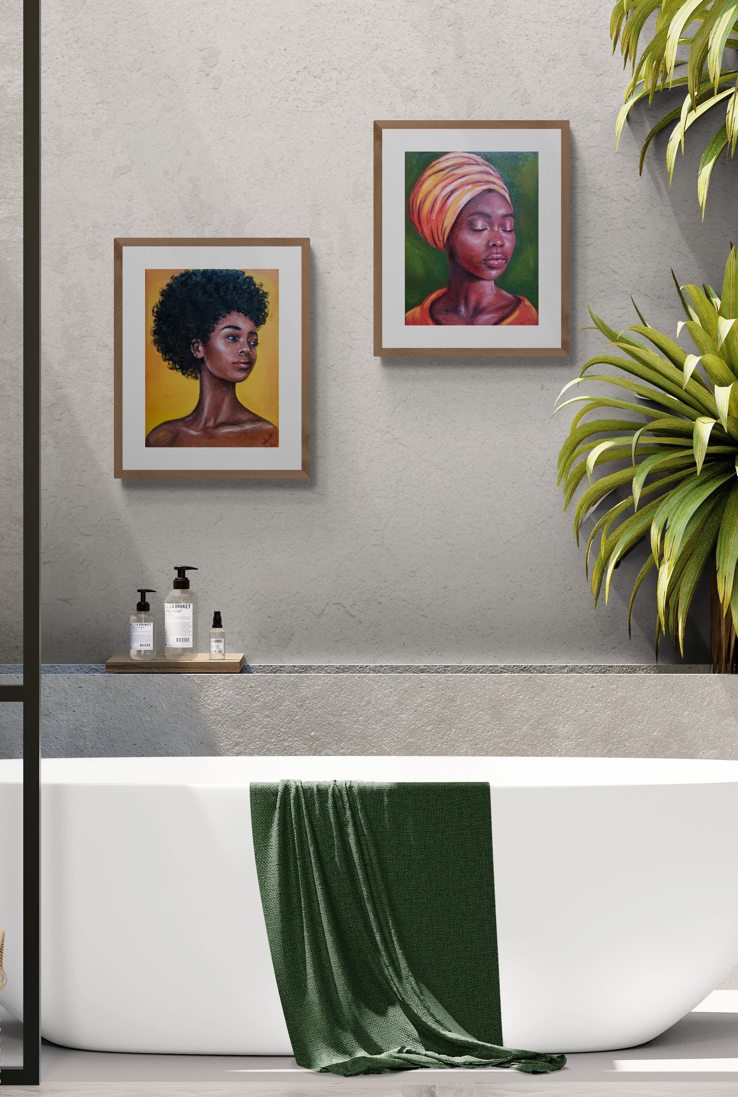Bathroom interior with framed artworks of a woman and a child, a green towel on a bathtub, and a plant.