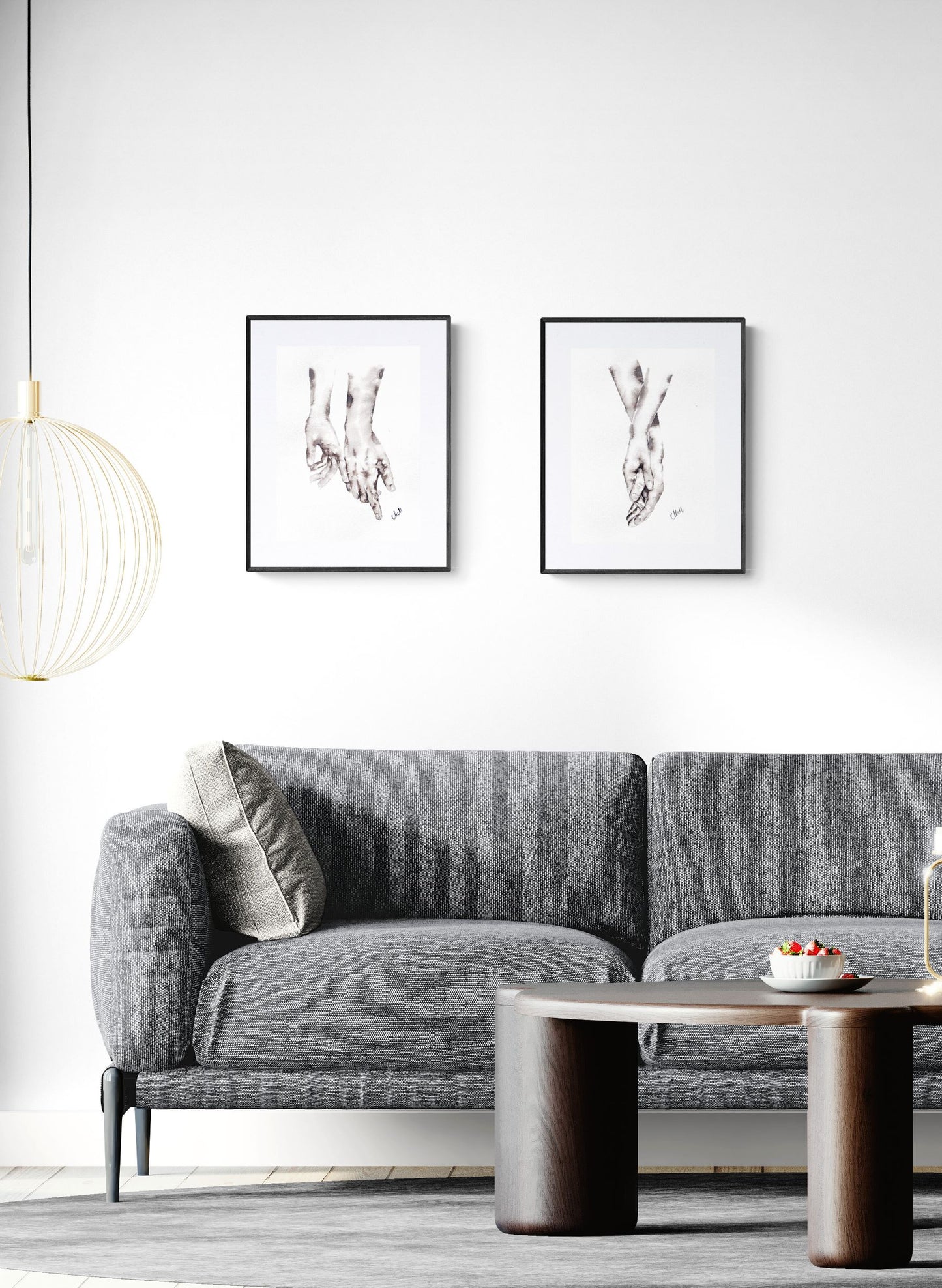 Modern living room with a gray sofa, coffee table, and framed artwork on the wall.