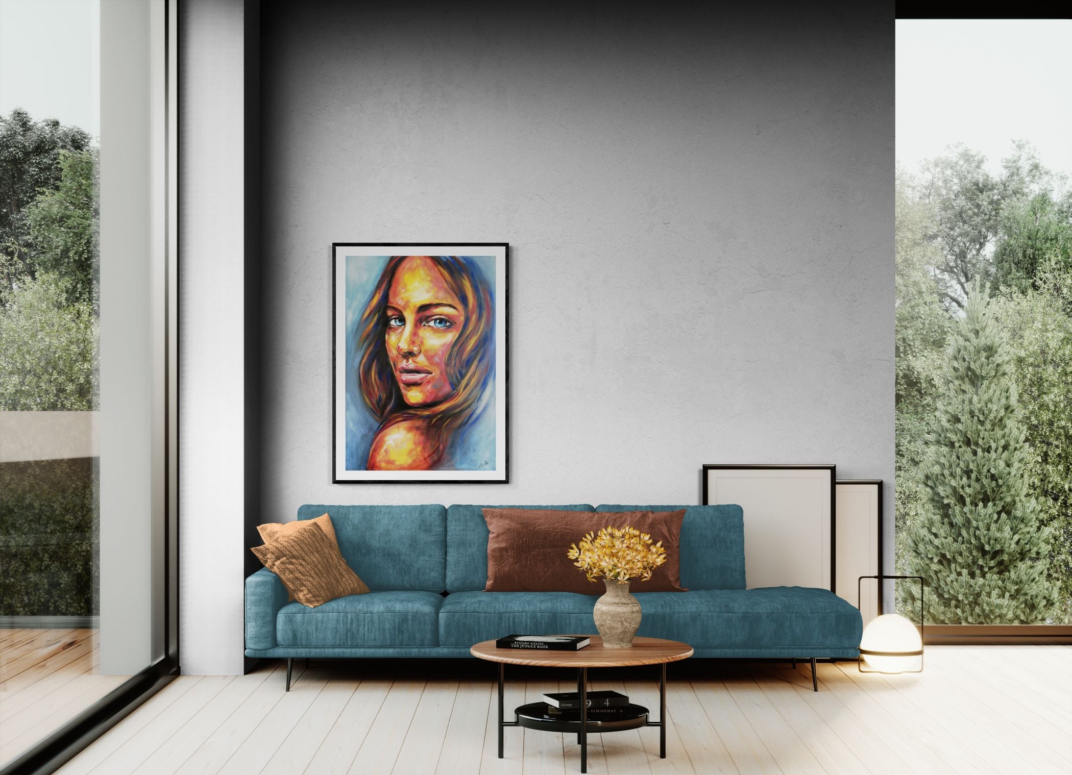 Modern living room with a blue sofa, coffee table, and framed artwork on the wall.