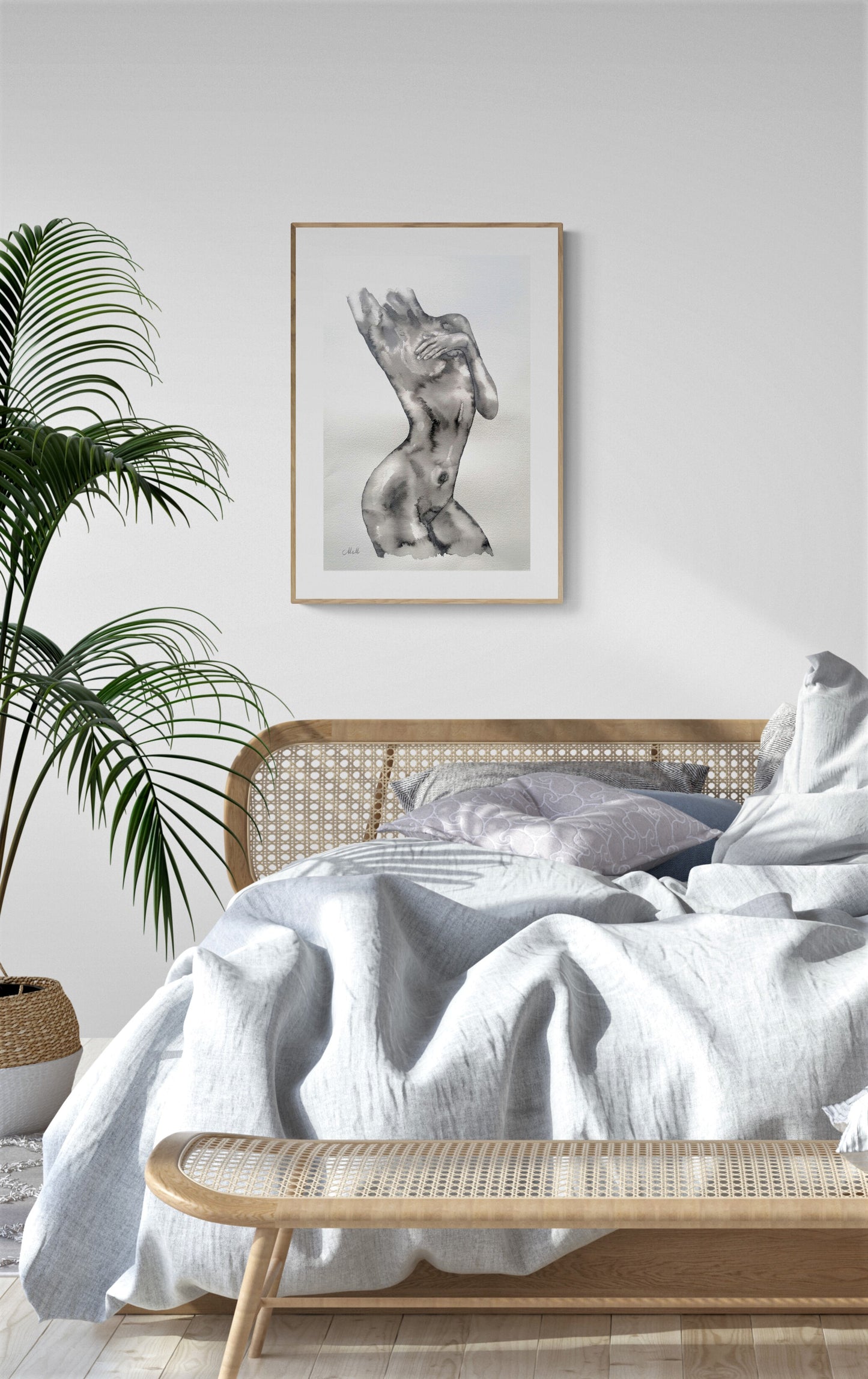Bedroom with white bedding, wooden bench, and framed artwork on a white wall.