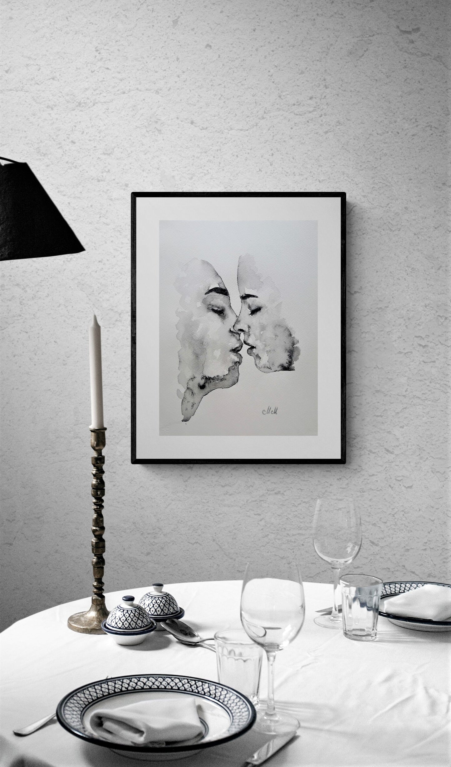  Lovers kiss - ink artwork for your dinin room
Framed black and white artwork above a table setting with candles andglasses.