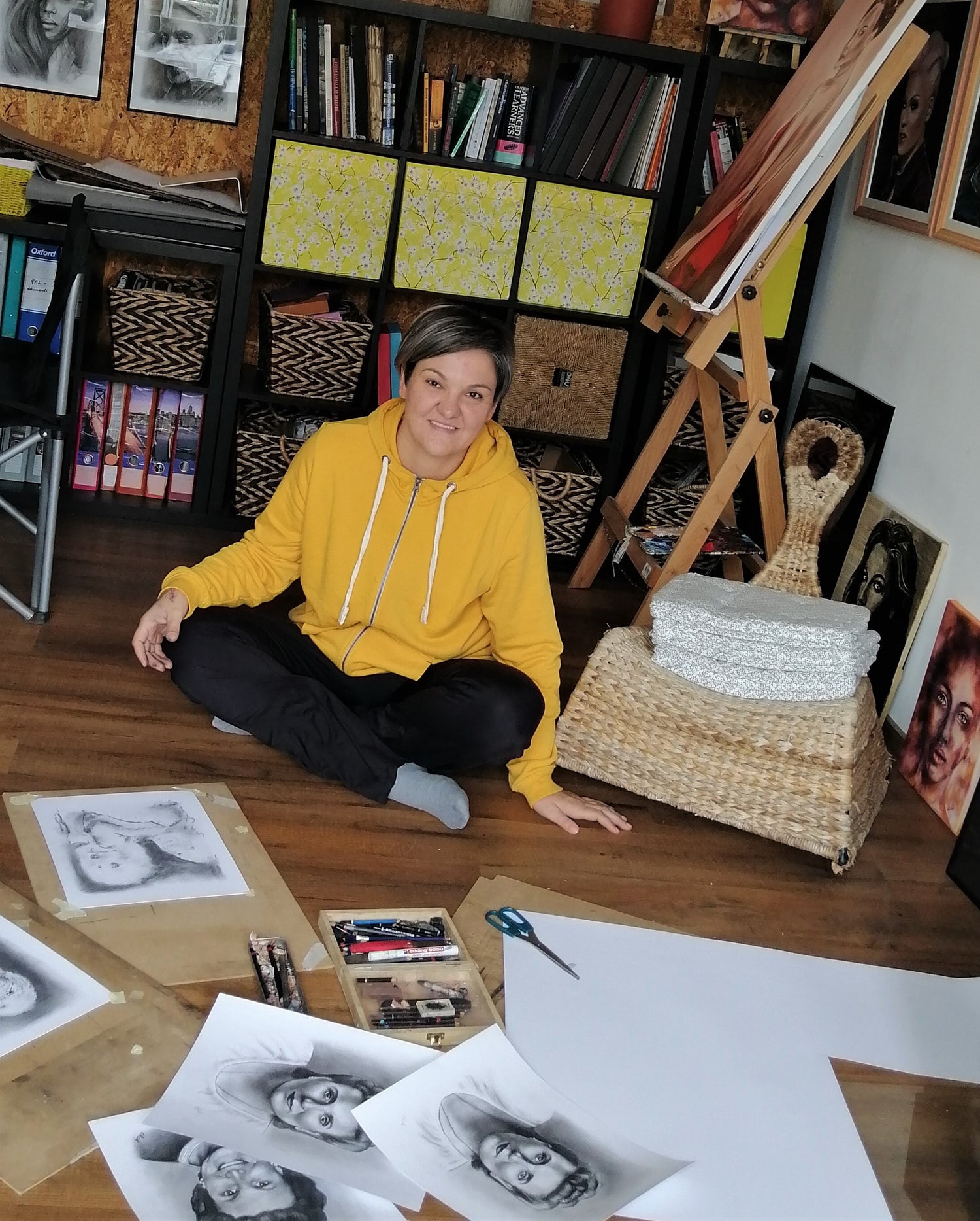 Portrait painter Mateja Marinko in art studio creating portrait paintings: oil portrait paintings, watercolor artwork, ink portrait art, erotic wall art, custom charcoal drawings, charcoal female figure drawings, acrylic mixed media art, holding hands, portrait paintings on wood, female face artwork, sensual paintings, commission art, portraiture...