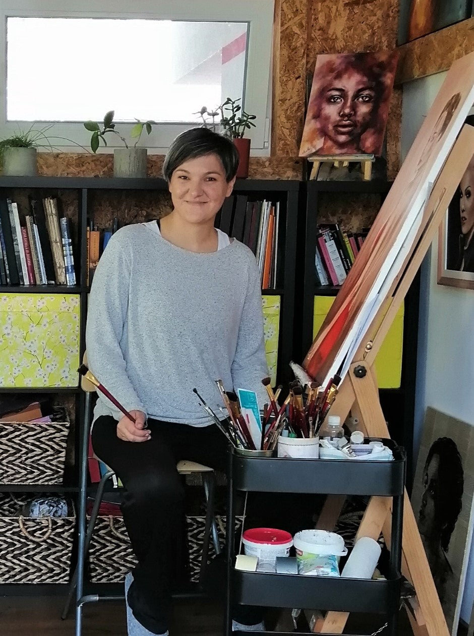 Portrait painter Mateja Marinko in art studio creating portrait paintings: oil portrait paintings, watercolor artwork, ink portrait art, erotic wall art, custom charcoal drawings, charcoal female figure drawings, acrylic mixed media art, holding hands, portrait paintings on wood, female face artwork, sensual paintings, commission art, portraiture...