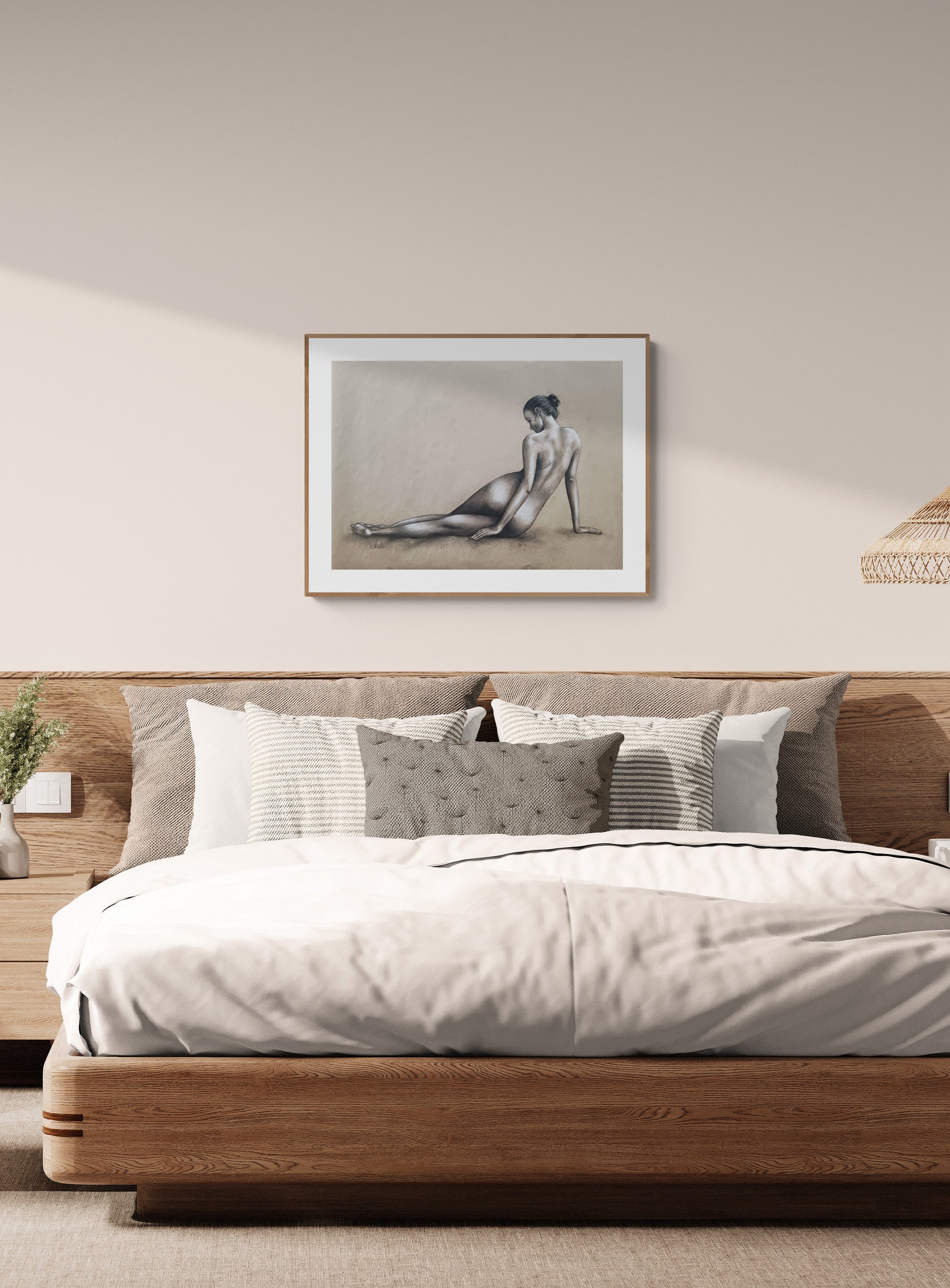 Bedroom with wooden bed, white bedding, and framed artwork on the wall.