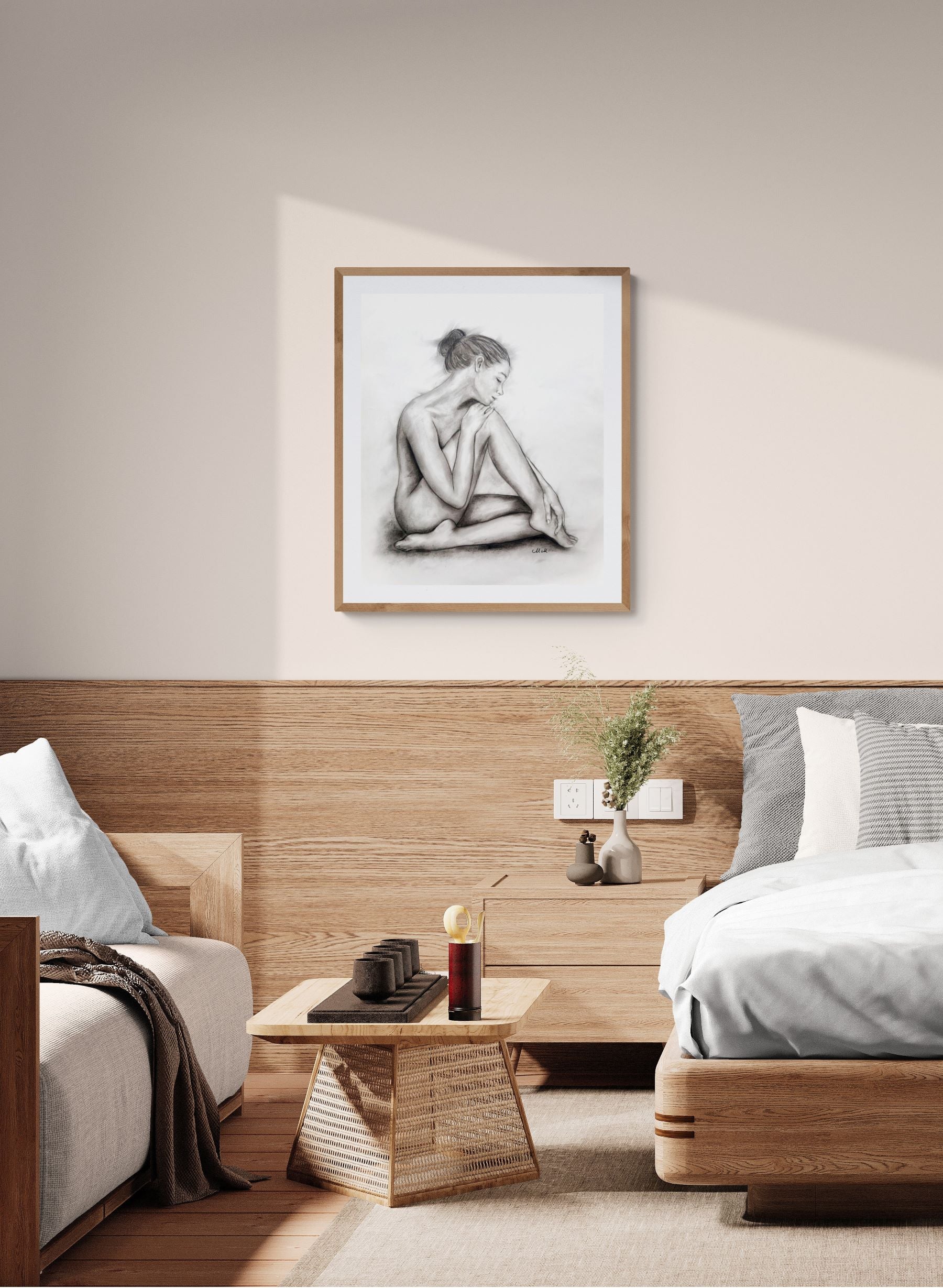 Modern bedroom with wooden headboard, framed artwork, and minimal decor.