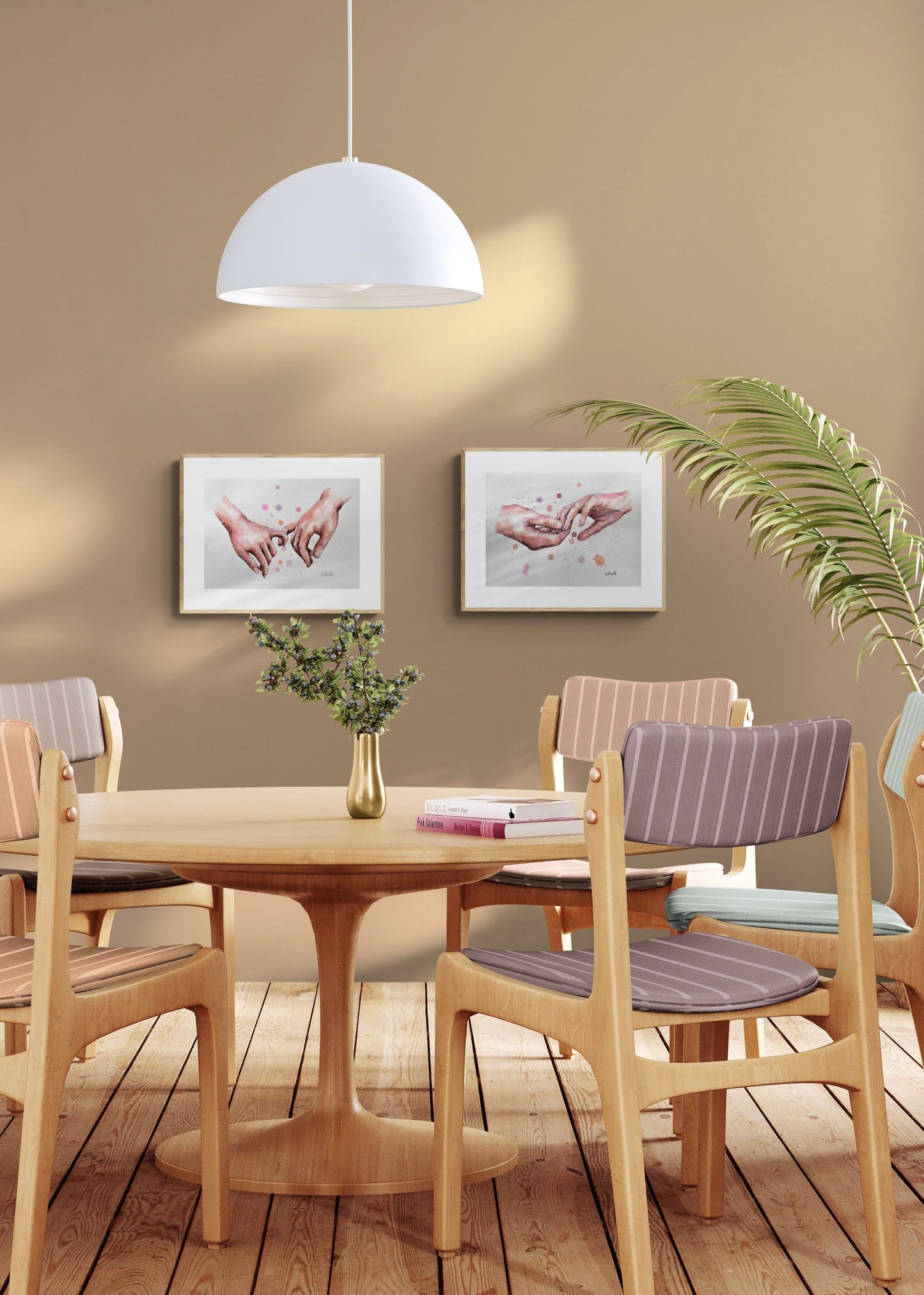 Dining room with wooden table and chairs, framed pictures on the wall, and a plant.