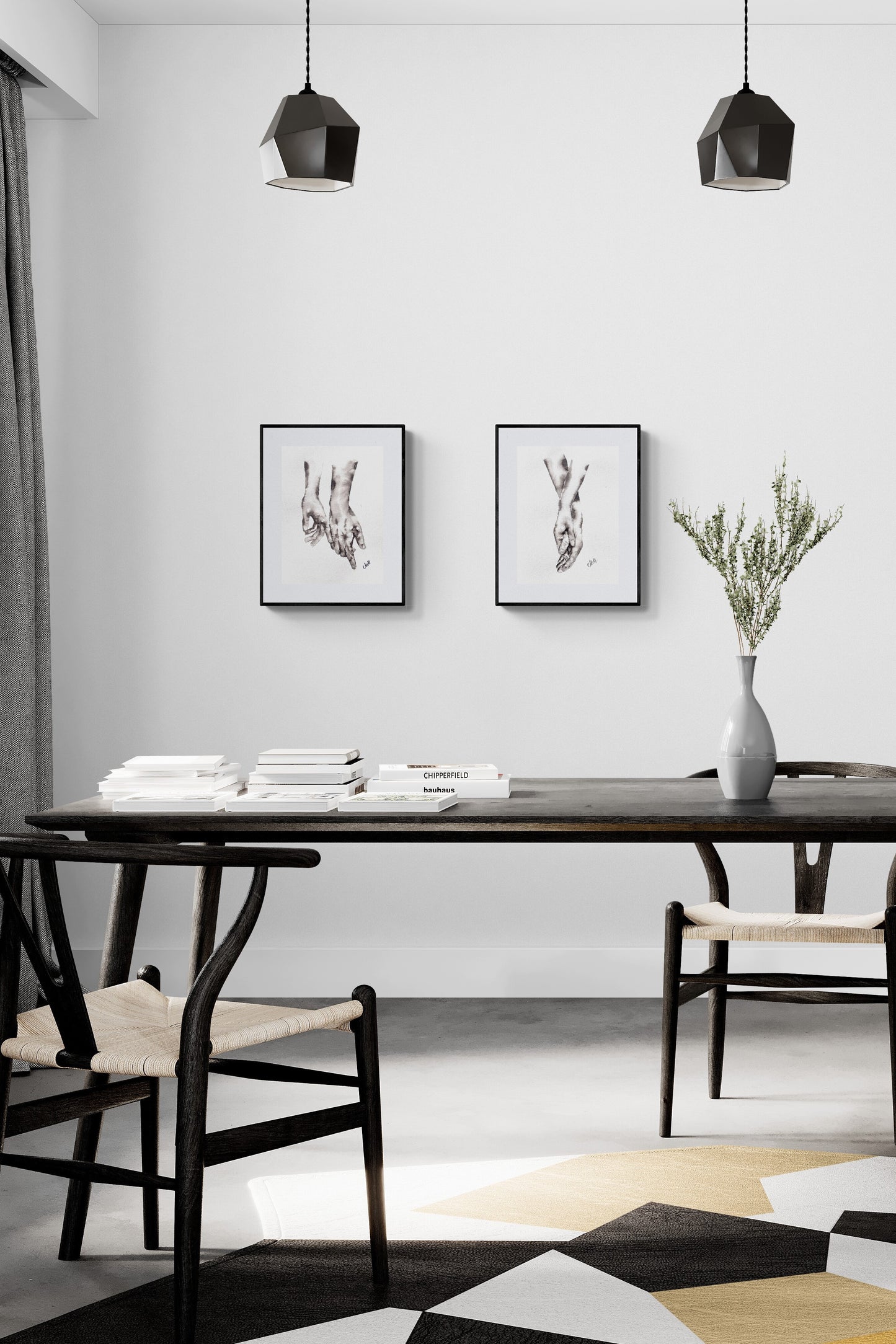 Modern dining room with black table, chairs, and abstract art on a white wall.