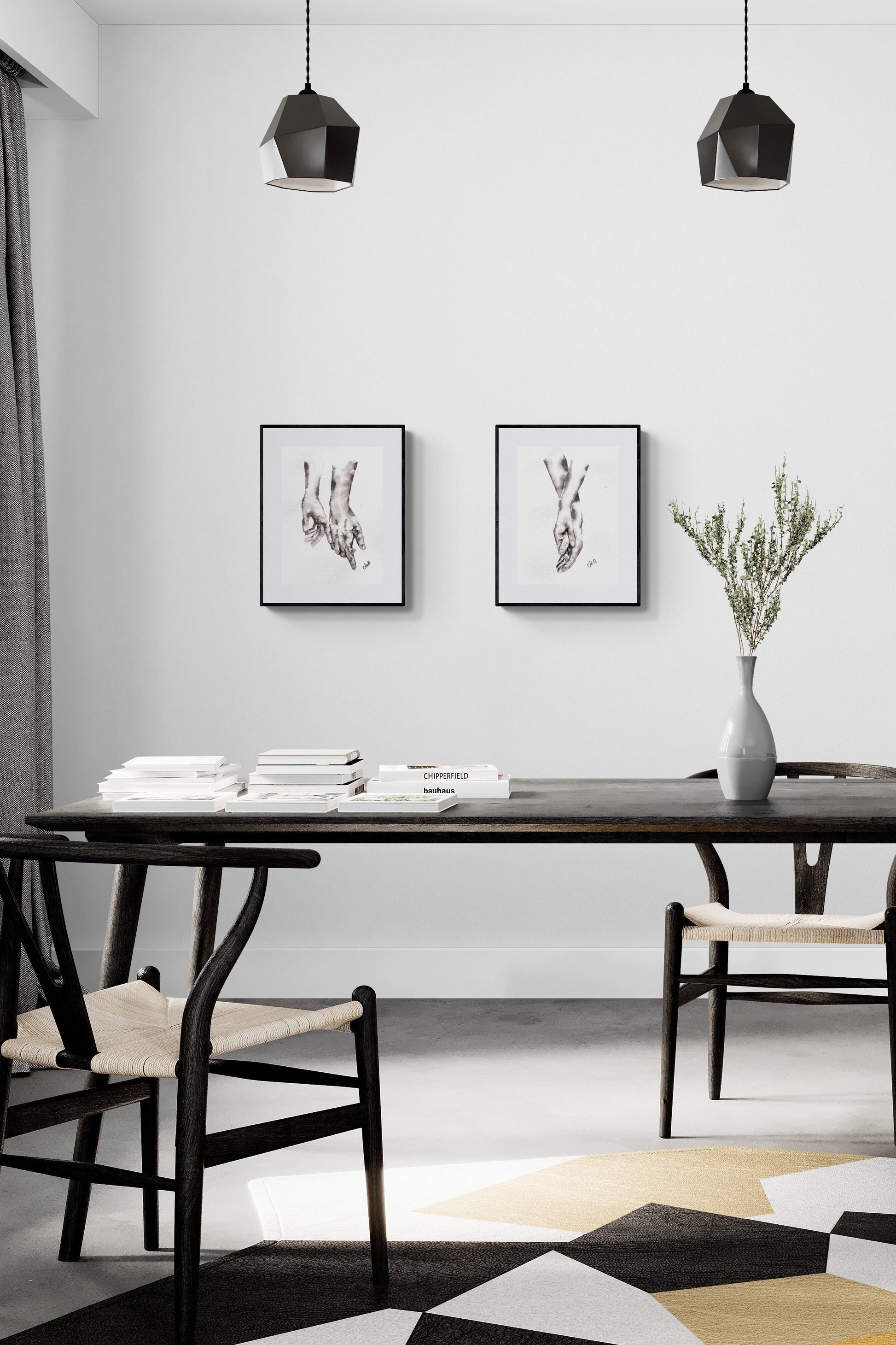 Modern dining room with black table, chairs, and abstract art on a white wall.