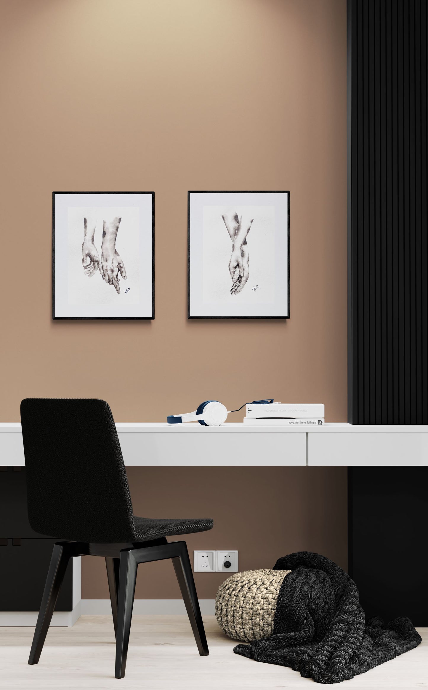 Modern interior with a black chair, white desk, and framed artwork on a brown wall.
