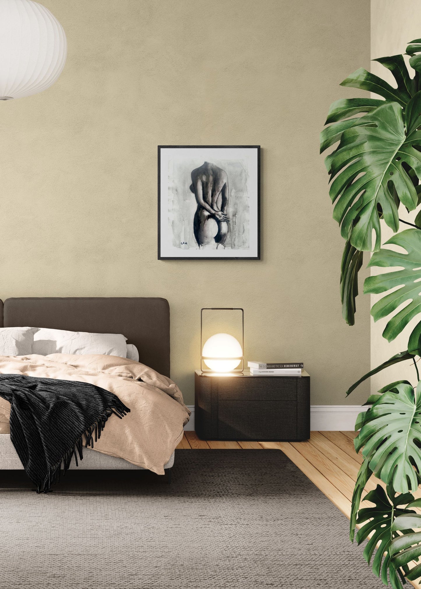 Modern bedroom with a bed, nightstand, lamp, and framed artwork on a beige wall.