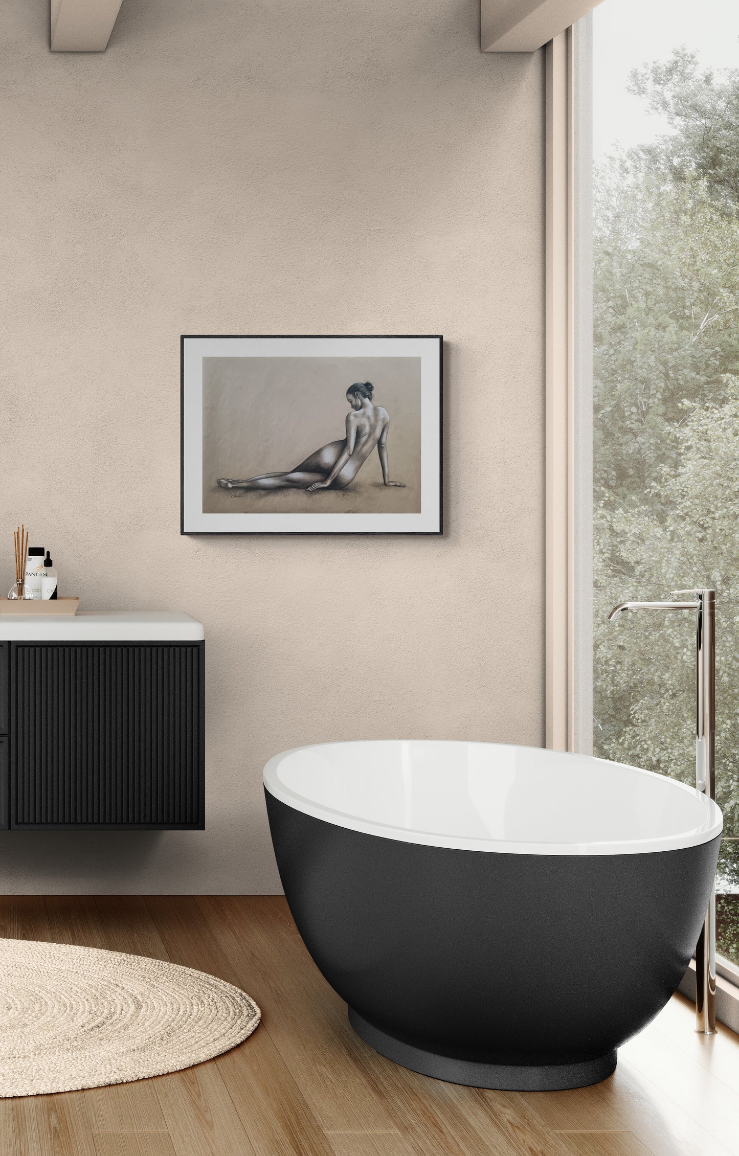 Modern bathroom with a freestanding bathtub, sink, and framed artwork on the wall.