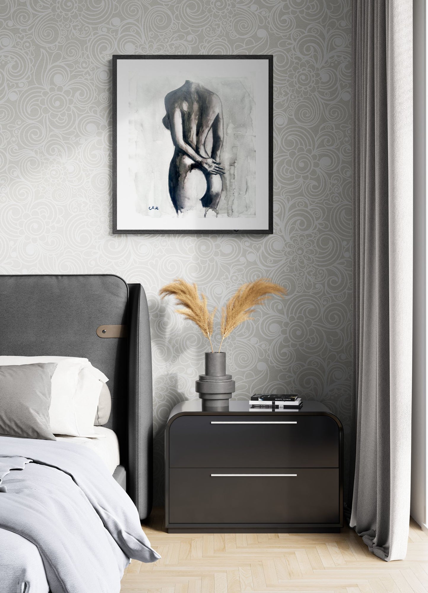 Modern bedroom with gray upholstered headboard, nightstand, and wall art.