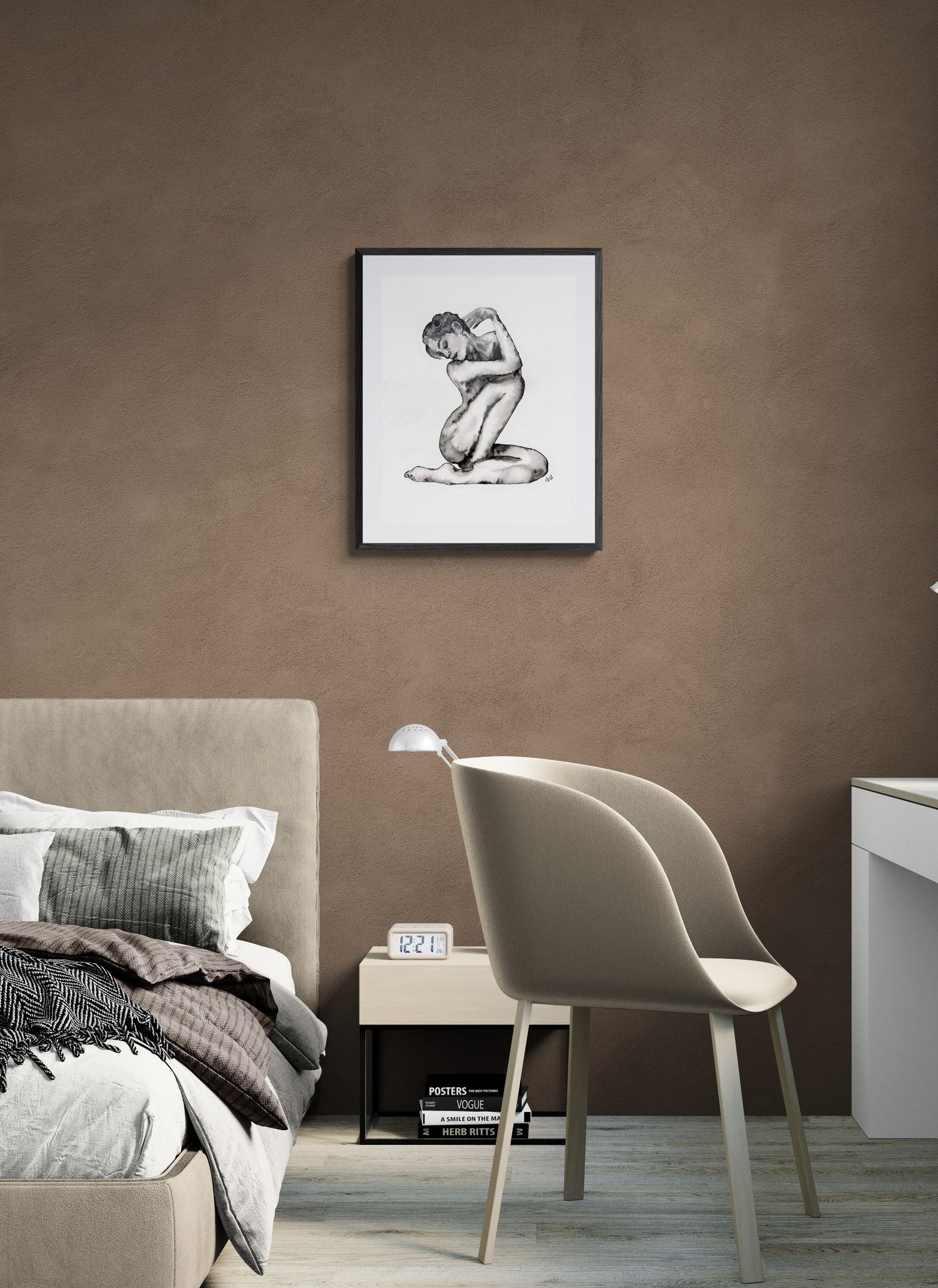 Framed artwork on a wall above a bed in a bedroom setting