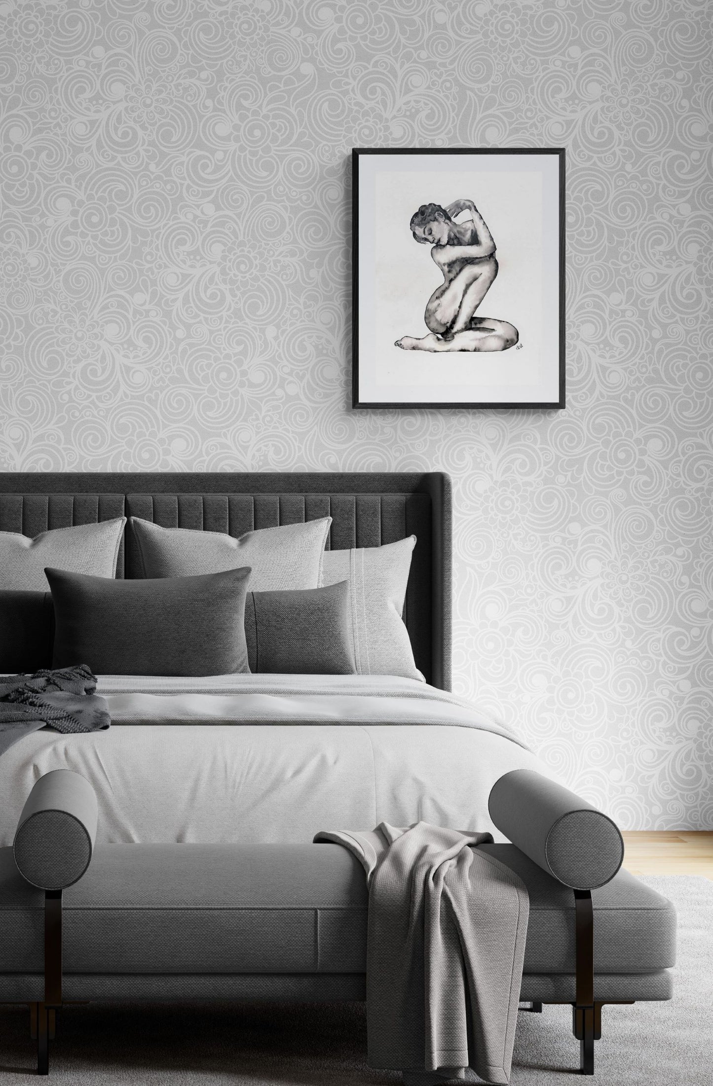 Bedroom with a bed and wall art featuring a nude figure.